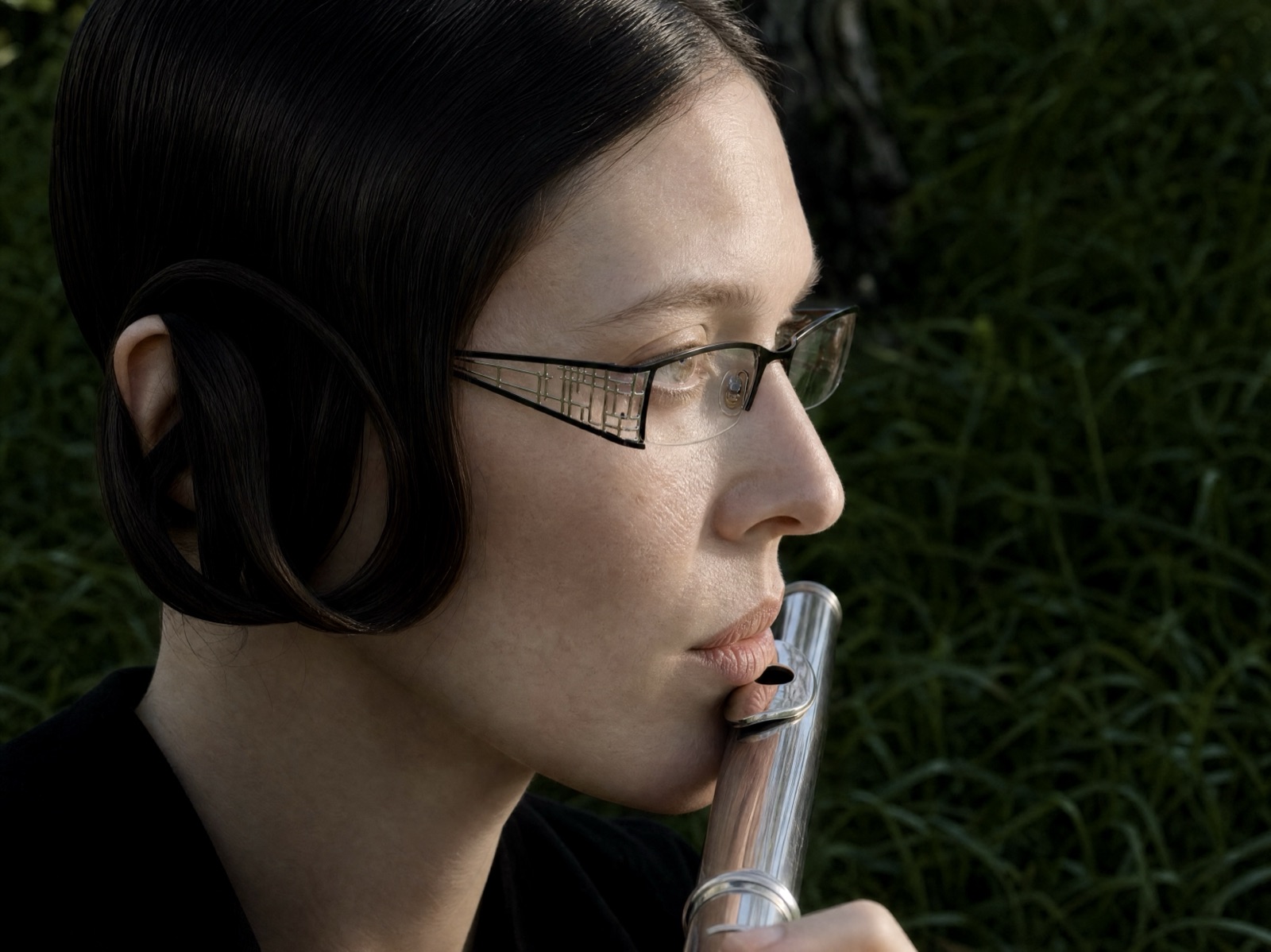 Close portrait of a person raising a glass flute to their lips